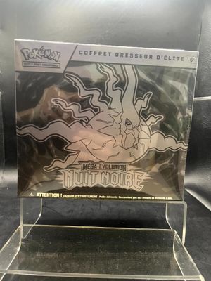a close up of a box of pokemon trading cards on a table
