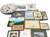 a large collection of framed and unframed art on a white surface