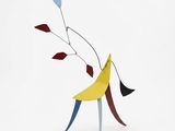 an abstract sculpture of a man with a banana on his back