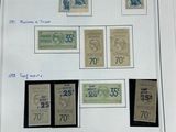 une image représentant une photo d'une collection de timbres sur une feuille de papier