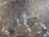 a close up picture of a silver plate with silver decorations on it