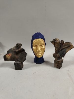 several pieces of art that are sitting on a white surface