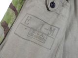 an image of a close up of a military uniform with a badge on it