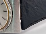 a watch that is sitting on a white table