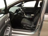 the interior of a car with the door open and the driver ' s seat down