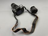 the camera strap is attached to the camera and ready to be used