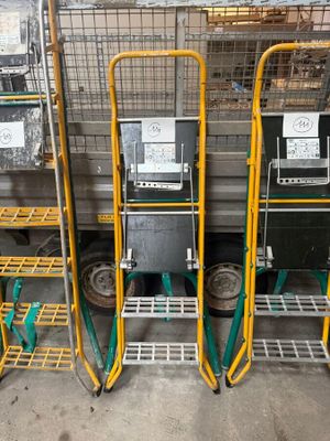several carts are lined up next to each other in a warehouse