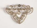 an image of a brooch with pearls and diamonds on a white background