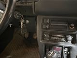 a car dashboard with a steering wheel and a control panel