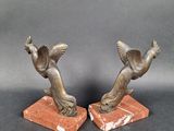 pair of antique bronze bird bookends on red marble bases