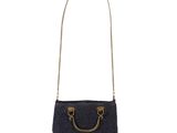 a black crocheted bag with a gold handle