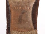 the bottom of a pair of brown leather shoes with a brown sole