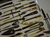 many different types of knives on the table