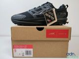 the box is open and the shoe is on top of the box
