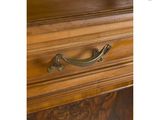 a close up of a wooden cabinet with a metal handle