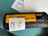 a black case with a yellow label on it and a pair of scissors
