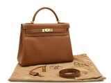a brown leather handbag sitting on top of a piece of paper
