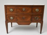 a small wooden chest of drawers with marble top