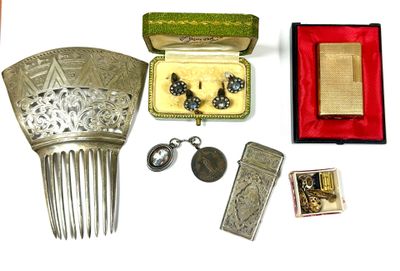 a lot of silver items that are sitting on a table