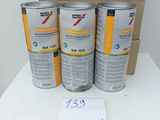 three cans of paint sitting on top of a table next to a cardboard box