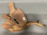 a bird that is sitting on top of a piece of wood