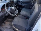 the interior of a small car with the door open