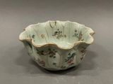 a small bowl with a bird design on it