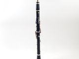 a close up of a black and silver clarinet on a white background