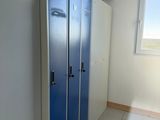 two blue lockers next to each other in a room