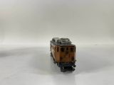 a toy train that is sitting on a white surface