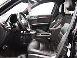 a picture of the interior of a car that is black and red
