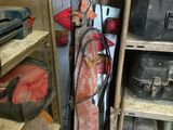 a small room with a bunch of tools on the shelves