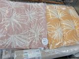 three pillows that are sitting on top of each other