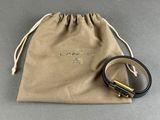 a brown bag with a black belt and a brown bag