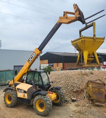 a construction vehicle that is sitting on a pile of dirt