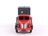 a toy truck that is sitting on a white surface