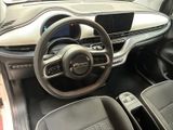 the interior of a car with a steering wheel, dashboard, and dashboard controls