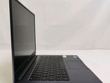 an open laptop computer sitting on top of a white table