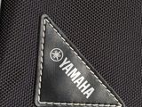 a close up of a black bag with a white logo on it