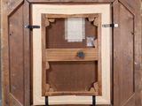 a picture of a wooden frame with a window in it
