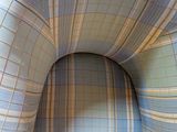 a chair that has a blue and white checkered upholstered