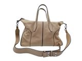 a close up of a handbag with a strap on a white background