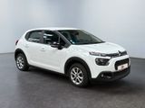 a white citrole is parked in a white room