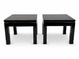 pair of black side tables on white background