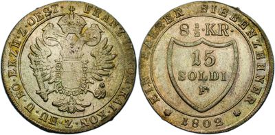 an old coin with a shield on the front and a shield on the back