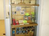 a glass display case with various items in it