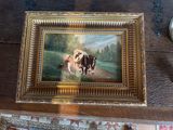 a picture of a painting of cows on a table