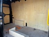 an image of a van being built in a garage