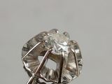 a close up of a ring with a diamond on top of it