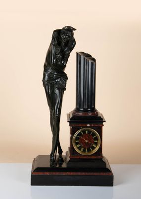 statue of a woman leaning on a clock with a clock in front of her